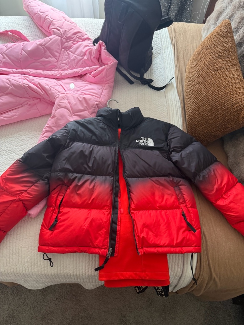 The North Face women’s Red to Black Ombre Puffer Coat